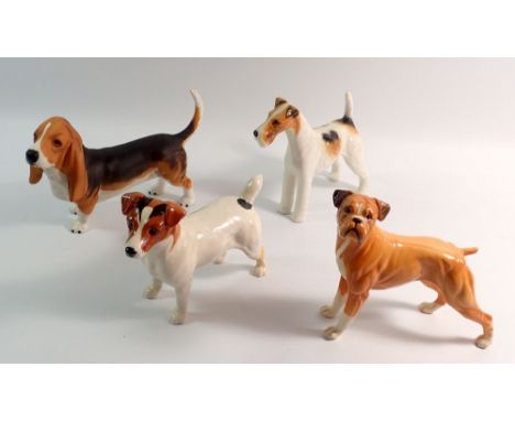A Beswick bisque Bassett Hound, a Boxer, a Jack Russell Terrier and a wire haired Talavera Romulus (Jack Russell and Talavera