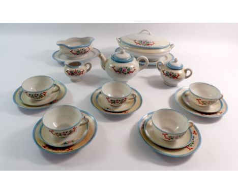 A Japanese eggshell child's tea service comprising five cups and saucers, five tea plates, teapot, jug, sugar, tureen, servin