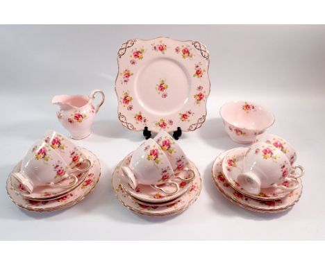 A Tuscan pink floral vintage tea service comprising six cups and saucers, six tea plates, cake plate, jug and sugar