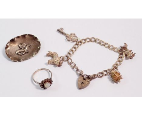 A silver charm bracelet, silver opal and garnet ring and an 800 standard silver brooch, 35g total weight