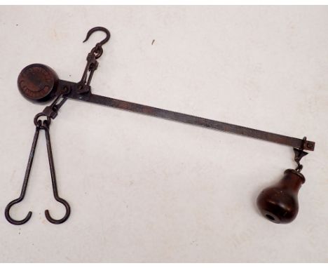 An antique Steelyards inscribed with scales for measure by W &amp; T Avery Ltd. 80cm long, in restored condition