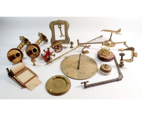 A box of various brass and metalware including candle holders, sundial etc.