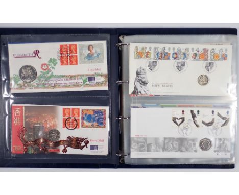 A Royal Mail/Royal Mint philatelic numismatic covers album containing 18 coin and stamp covers including NHS, Royal Beasts, N