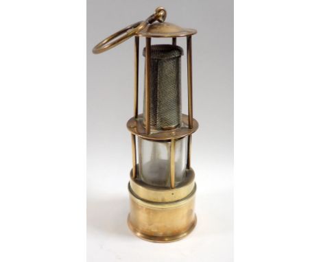 A miniature brass mining lamp, 18cm tall