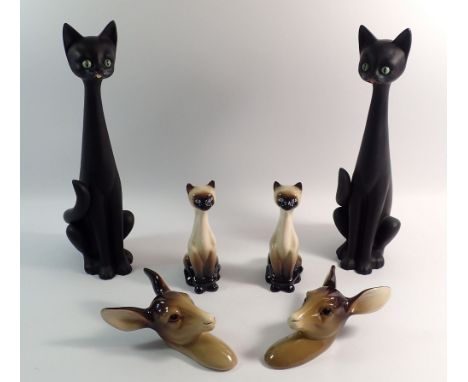 A pair of vintage Midwinter deer head wall plaques, a pair of Siamese cats and a large pair of black stylised cats, 34.5cm