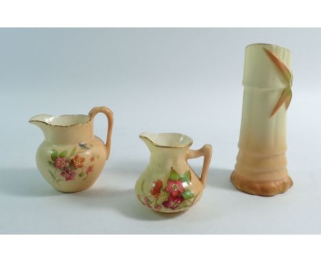 Two Royal Worcester ivory blush miniature jugs painted flowers, G1057 and G1022 and a bamboo spill vase, No 1049 - 10cm