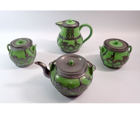 A Chinese green and pewter mounted four piece tea service with dragon decoration by Hsin Ho Cheng 