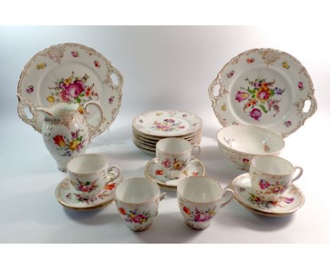 A Dresden floral painted tea service comprising four cups and six saucers, six tea plates, two cake plates, milk and sugar