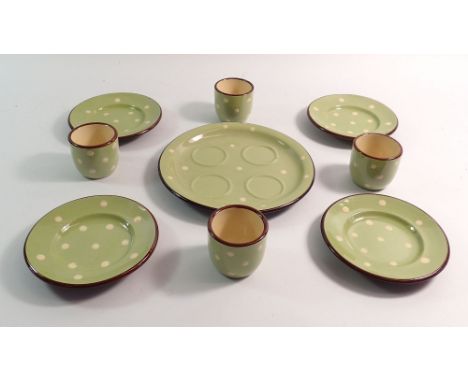 A vintage Sandygate Pottery green spotted eggcup set and four small plates 