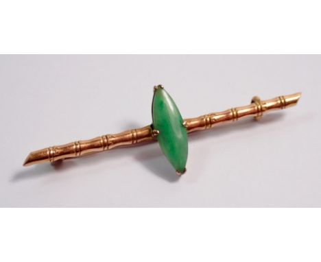 A Chinese 18 carat gold bamboo bar brooch set marquise cut jade, 5.5cm wide, jade 1.5 x 0.5cm, 2.8g