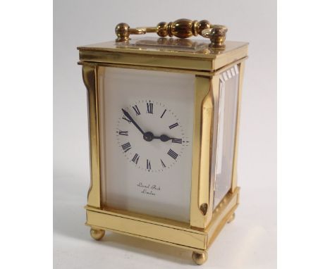 A Lionel Peck small brass 8 day carriage clock, 8cm tall