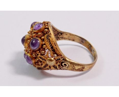 A silver gilt vintage Eastern domed ring set seven cabochon cut amethysts, adjustable size