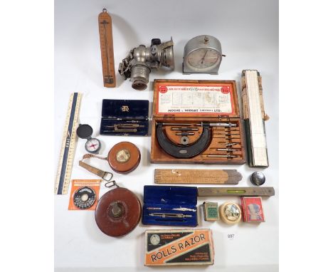 A box of collectables including a Millers Cetolite lamp, Moore and Wright micrometer set, various measuring rulers, compasses