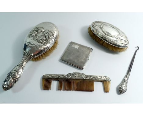 A group of silver dressing table items including brush decorated angel heads, Birmingham 1914, comb and gentlemen's brush, Ch