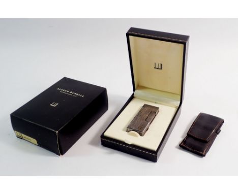 A Dunhill silver plated lighter with original case, box and receipt etc.