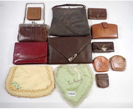 A group of various leather vintage purses, wallets and handbags