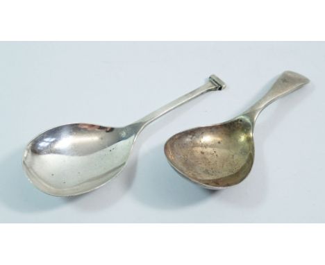 Two silver caddy spoons, one with nail top handle, Birmingham 1933 by W H Haseler and another Old English pattern caddy spoon