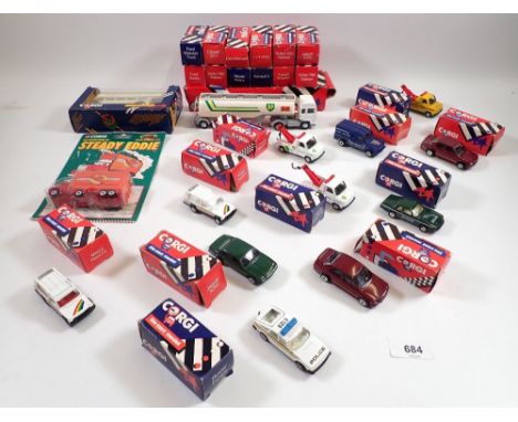 A group of twenty six boxed Corgi die cast vehicles including Seddon Atkinson Tanker, Jaguar track car, Rover Police, The Adv