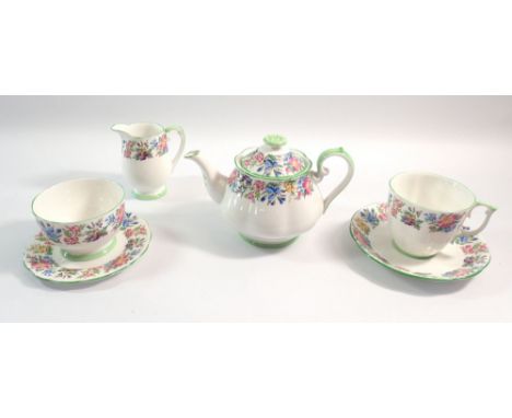 A Roslyn floral bachelor tea service comprising teapot, milk, sugar, cup and saucer and small plate