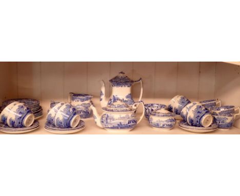 A Spode Italian tea service comprising twelve cups and saucers, teapot, coffee pot, two jugs, two sugars and twelve saucers