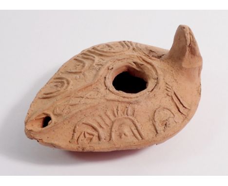 A terracotta oil lamp, 9cm