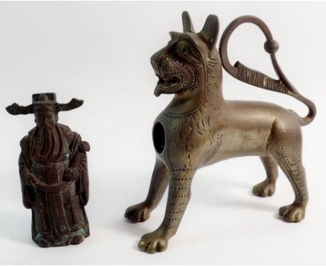 An Indian brass lion form oil lamp 13cm tall and a Japanese cast bronze figure of a dignitary 