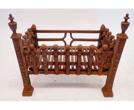 An antique cast iron fire grate, 52cm wide