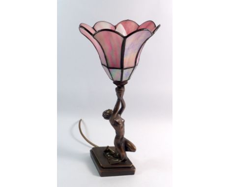 An Art Deco style table lamp with female figure and purple glass shade, 37cm tall
