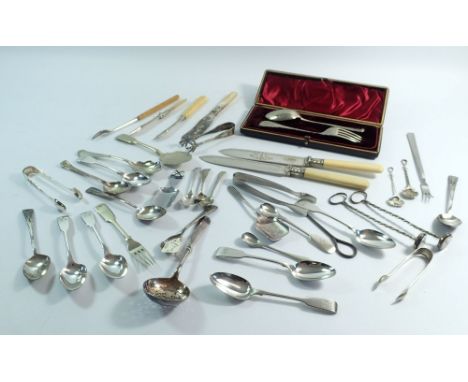 A Victorian silver plated christening spoon and fork cased and various other silver plated specialist cutlery, two cocktail m