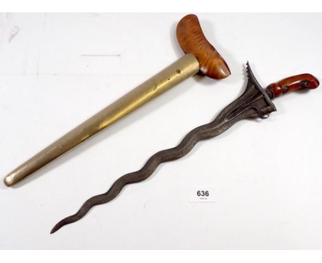 An Indonesian Kris with etched blade, carved handle and brass and wood scabbard, total length 44.5cm