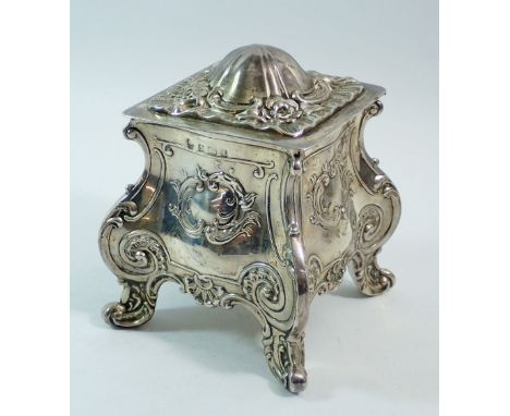 A silver bombe form embossed tea caddy, 12cm tall, Birmingham 1910, makers mark rubbed, 303g