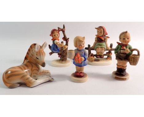 Four various Hummel figures and a zebra 