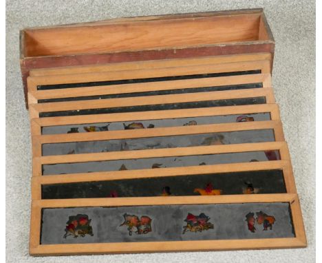 A boxed collection of nine Victorian magic lantern coloured glass slides L.46cm 