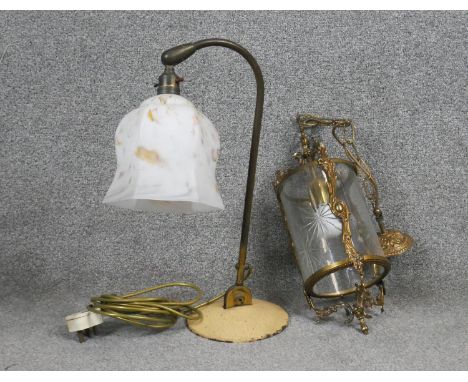A victorian style brass and engraved glass ceiling lantern along with a vintage enamel desk lamp with marbled glass shade. 