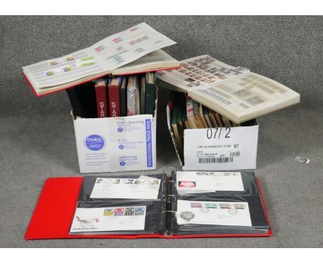 A collection of twenty three albums of world and Commonwealth stamps including some first day covers. 