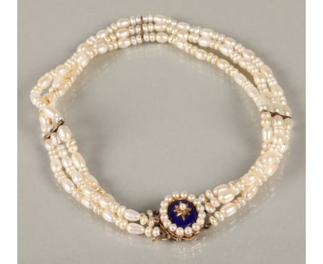 Ladies three strand pearl choker necklace with a 9ct yellow gold enamel pearl set clasp, 36cm long.