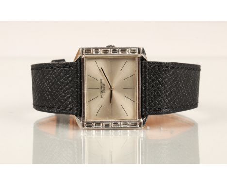Patek Philippe 18ct white gold wrist watch with baguette diamond bezel on a black leather strap, case diameter 3cm