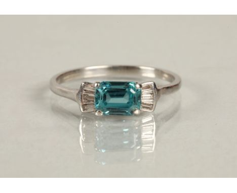 Zircon and diamond ring, rectangular cut blue zircon flanked by three baguette cut diamonds either side, set on white metal s