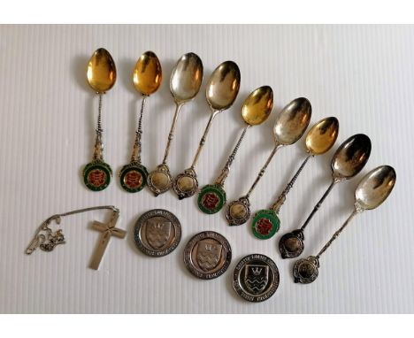 A selection of silver presentation teaspoons, three silver medals, a silver bangle and a crucifix and chain, all hallmarked, 