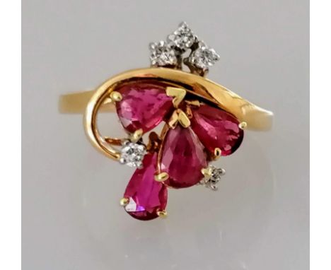 A ruby and diamond ring with pear and brilliant-cut stones on 9ct yellow gold, size L, hallmarked, 5.24g, tiny chip to one ru