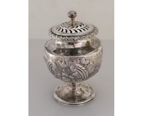 A George III silver pot-pourri holder of urn form with rococo and c-scroll decoration, pierced lid and body on a spreading fo