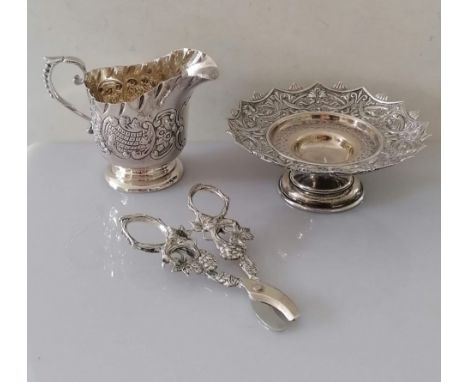 A Victorian silver tazza with pierced and embossed rococo design on a stepped foot by Haseler Brothers, Birmingham, 1886, 5 h