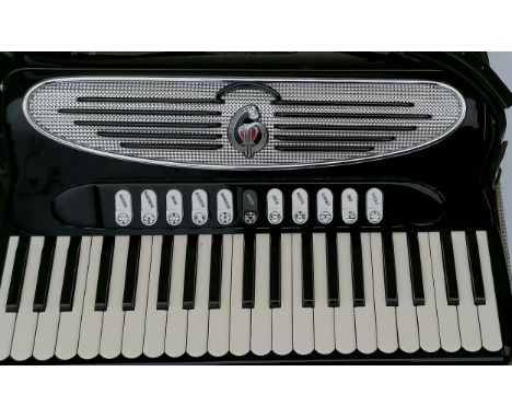 A Giulietti Classic 57 full-sized cased accordion, 41 keys, in seemingly good working order