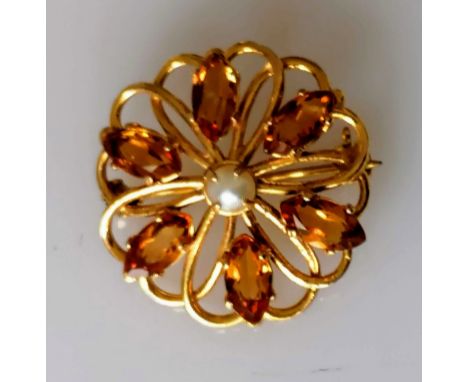 A circular citrine brooch in 9ct yellow gold centred with a pearl, 28mm diameter, hallmarked, 4.4g