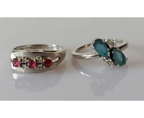 A mid-century white gold, diamond and ruby ring and a aquamarine and diamond ring, sizes N, both stamped 750, 7.4g (2)