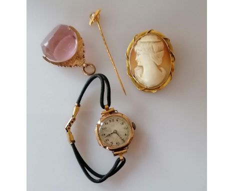 A 9ct gold framed cameo brooch, 42 x 33mm; a 15ct gold pin brooch with pearl decoration, both stamped; a mid-century ladies g