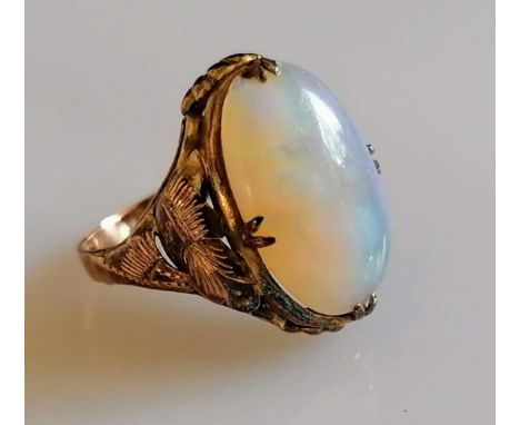 An oval opal ring on a gold claw setting, stamped 14k, size M, 3.2g, slight chip to opal (16mm x 11mm) under x 10 loop