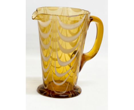 A vintage Amber Glass pitcher jug with Milk Glass drapes. Circa 1930-1950. 19x12x19cm 
