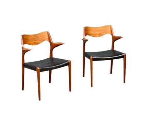 A pair of rare Danish Mid Century teak carver armchairs designed by Niels Otto Moller for J.L. Moller. Model 55. Designed in 