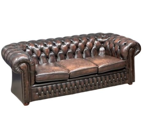 A deep buttoned leather 3 seater sofa. 211cm 